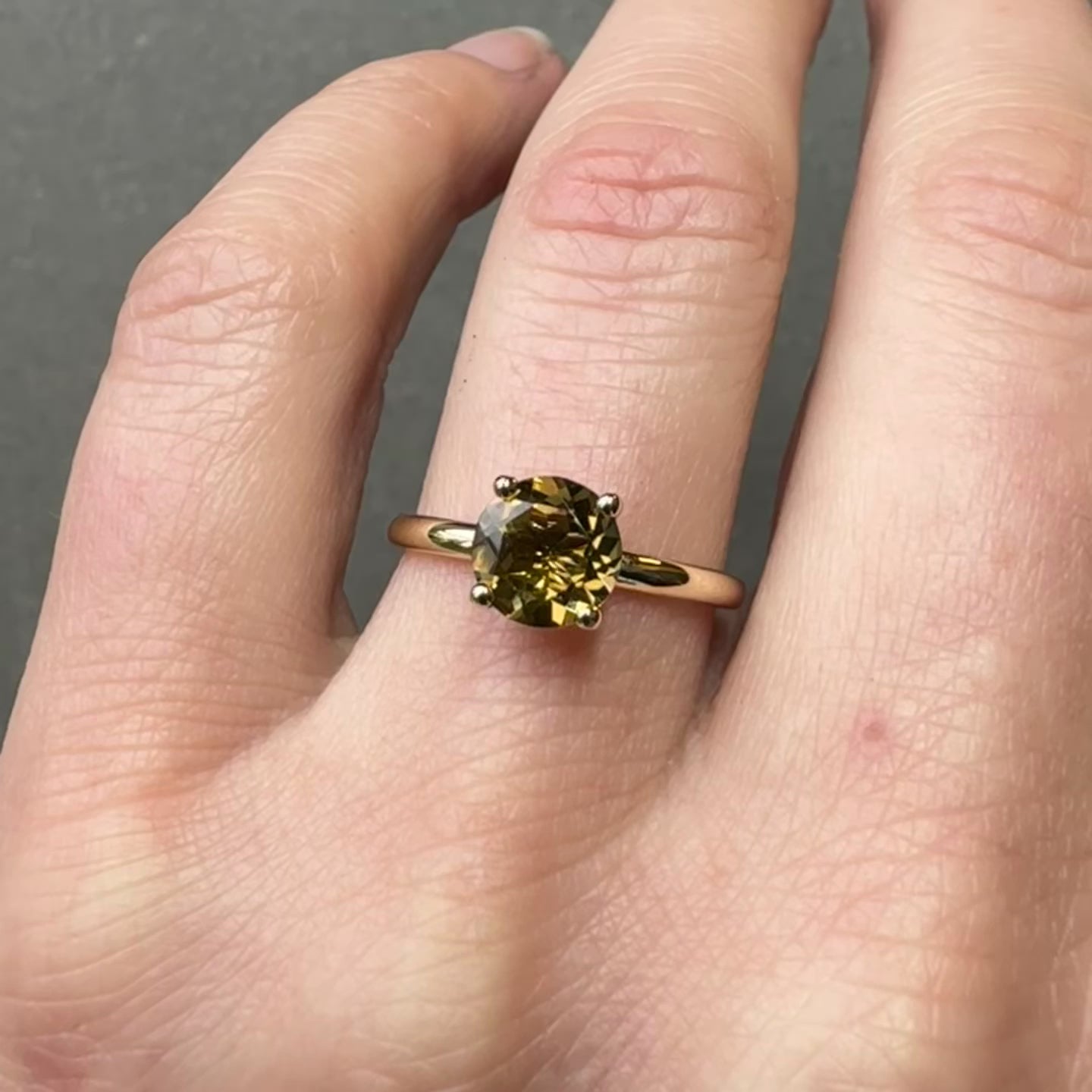 brown tourmaline gold ring on hand