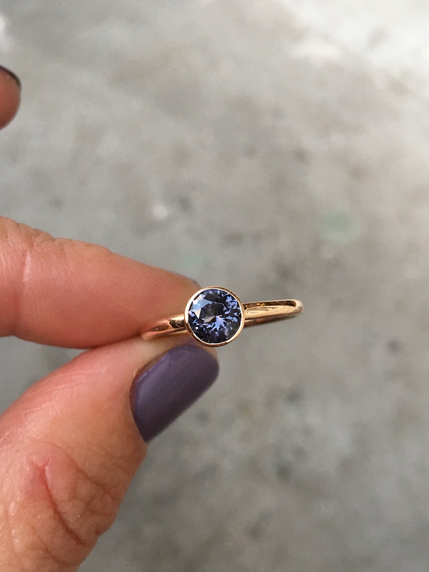 14k rosé gold ring set with an iolite