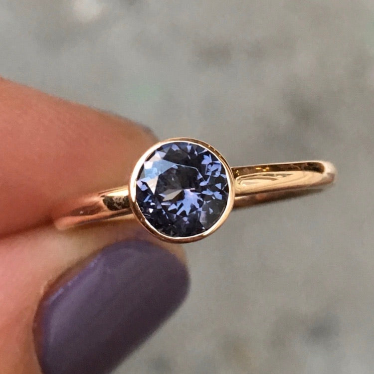 14k rosé gold ring set with an iolite