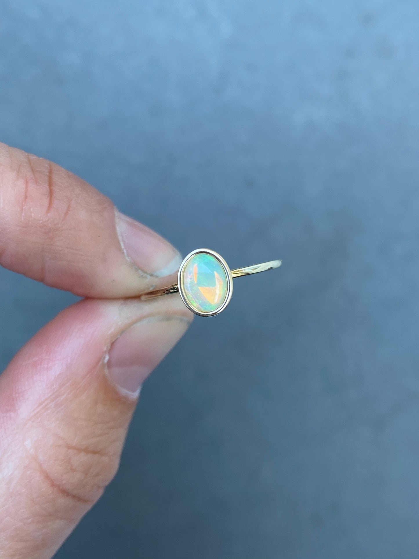 Big Oval Opal in 14k yellow gold ring